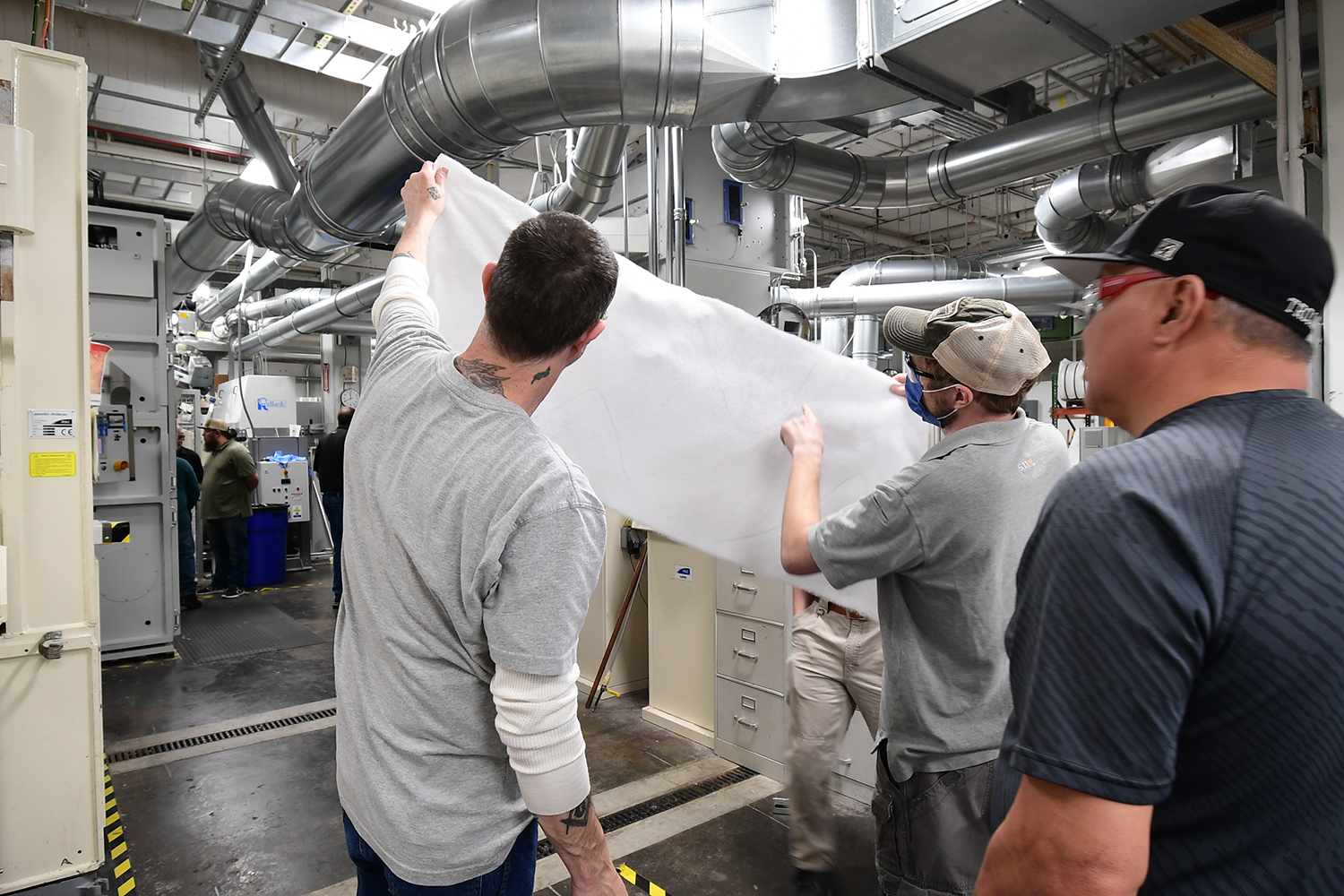 Inspecting nonwoven from NWI Staple Nonwovens Pilot Lab