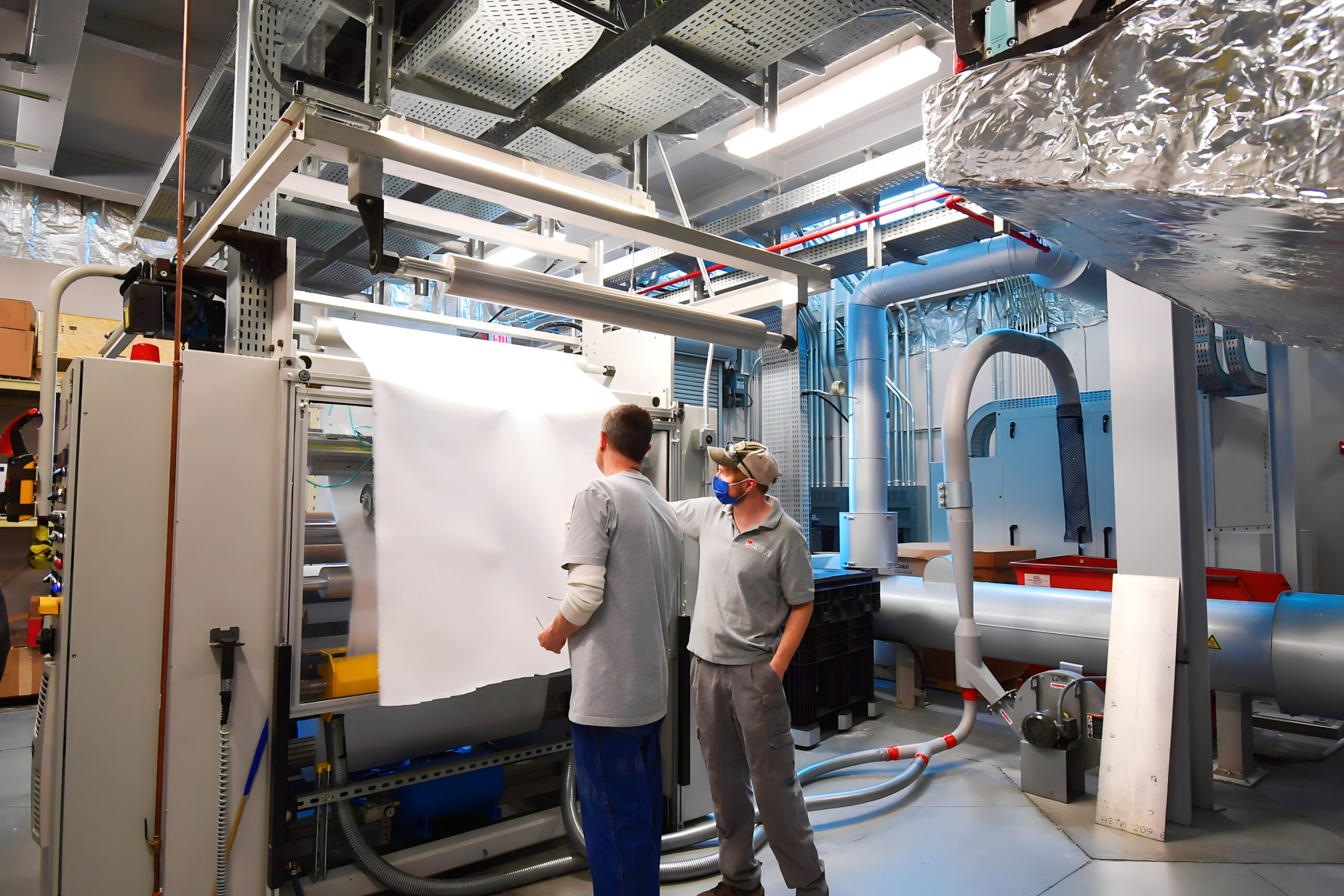 Inspecting meltblown nonwoven material produced on NWI's meltblown pilot line.