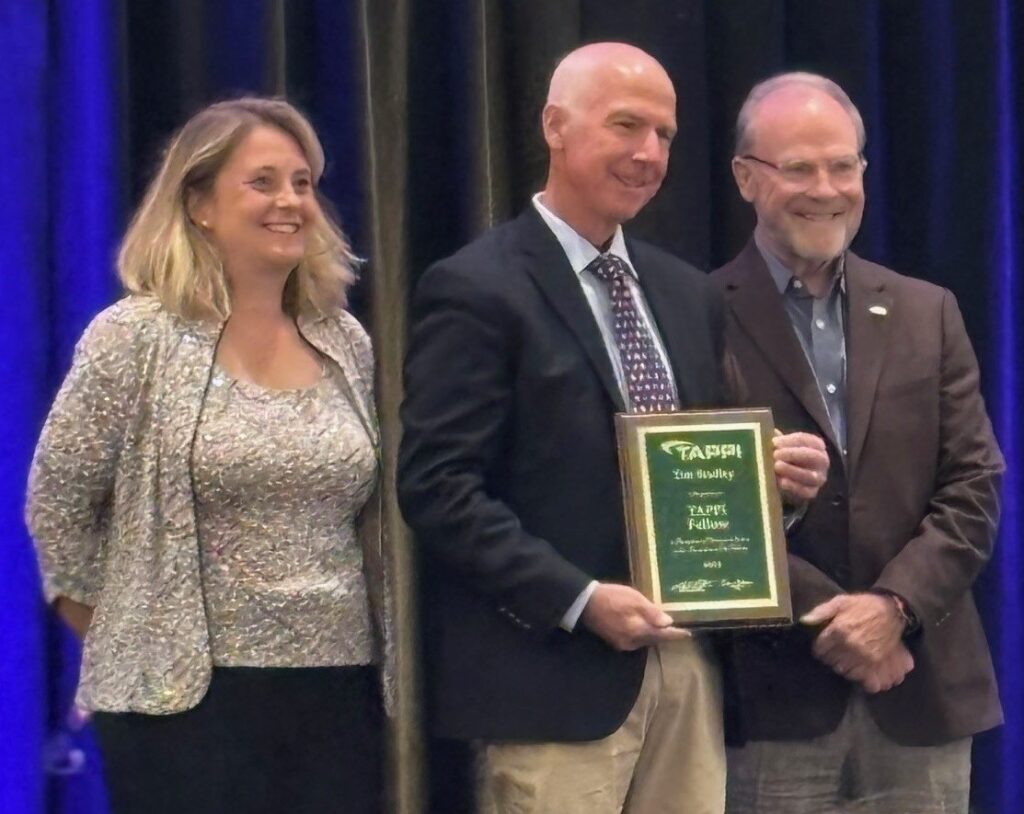 MiniFIBERS team being recognized for an award