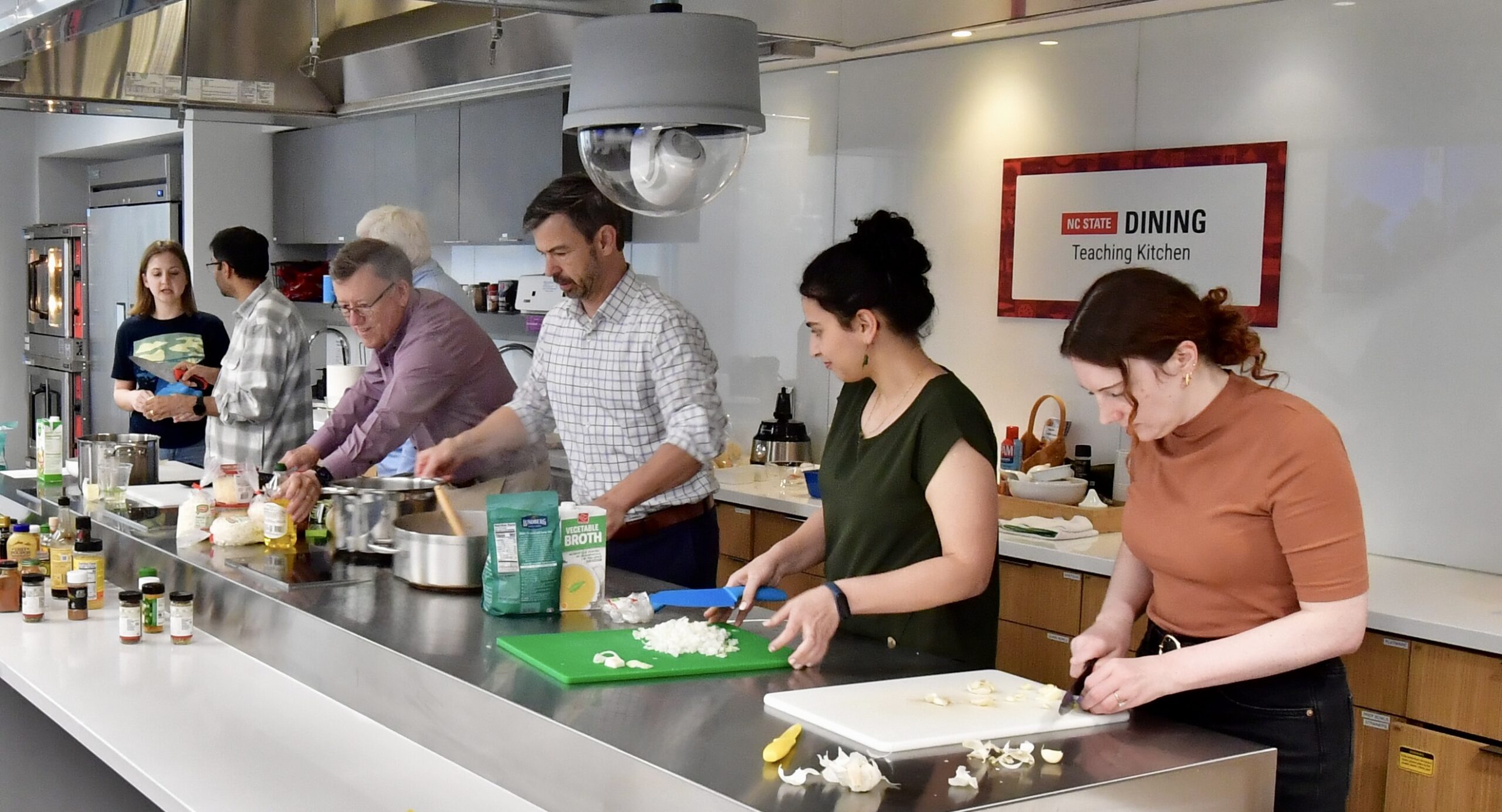NWI team cooking in the NC State teaching kitchen